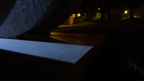 Scanning a light through a wall at night in the city Stock Footage 210225764