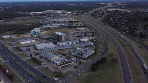 Scanning Over a Small City While Traffic Moves Below, Bryan, Texas, USA Stock Footage 145950485