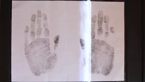Scanning palms prints on paper. Stock Footage 149919342