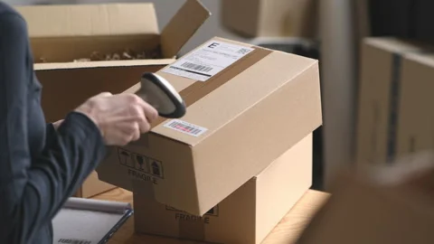 Scanning parcel barcode before shipment Stock Footage 199061238