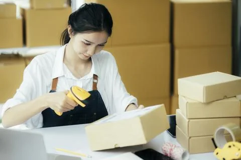 Scanning parcel barcode before shipment.. Stock Photos