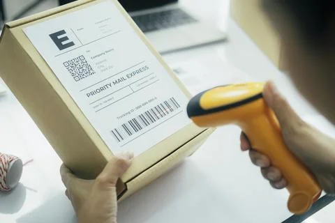 Scanning parcel barcode before shipment.. Stock Photos