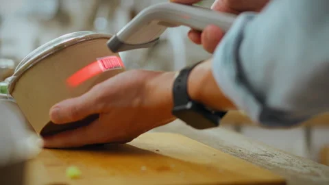 Scanning a product barcode in a kitchen during meal preparation at a busy re Stock Footage 289572002