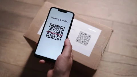 Scanning QR Code on Cardboard Parcel Using Cell Phone Indoor at Apartment Stock Footage 197562705