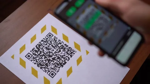 Scanning the QR code on the display using a smartphone Stock Footage 147110853