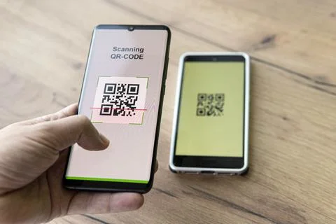 Scanning QR code with mobile smart phone. checking qr code on the mobile phon Stock Photos