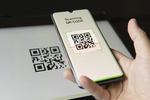 Scanning QR code with mobile smart phone. all graphics on the screen are made Stock Photos