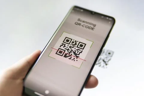 Scanning QR code with mobile smart phone. all the graphics on the screen are  Stock Photos
