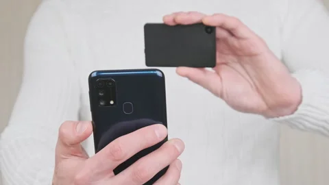 Scanning QR Code with a Modern Cold Crypto Wallet and Smartphone Stock Footage 197524802