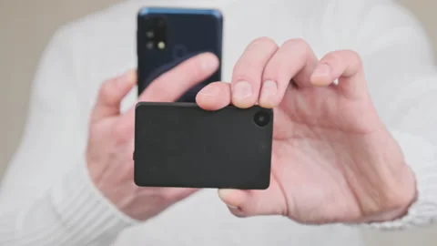 Scanning QR Code with a Modern Cold Crypto Wallet and Smartphone Video stock 198959672