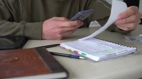 Scanning a QR code from a receipt.  QR Code Payments Stock Footage 142000884