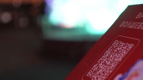 Scanning QR code with smart phone. The woman reads the bar code using the Stock Footage 121613095