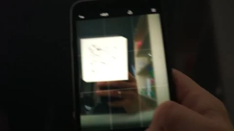 Scanning QR code with smart phone. The man reads the bar code using the Stock Footage 131646160