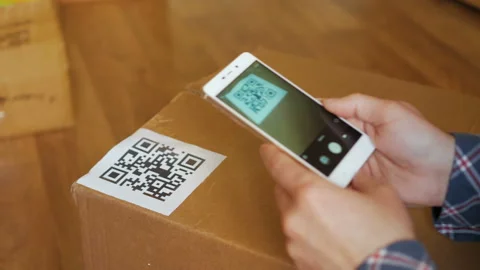 Scanning QR code with smart phone. The man reads the bar code using the appli Video stock 135529791