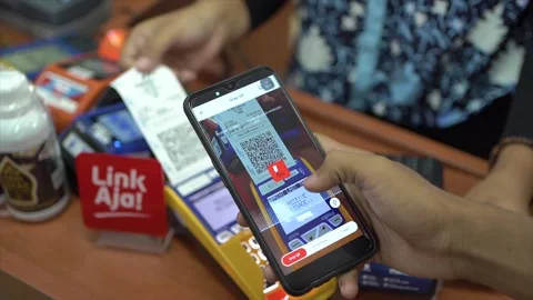 Scanning QRIS or Quick Response Code Indonesian Standard, code as cashless Stock Footage 249662984