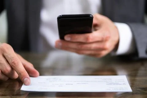 Scanning Remote Deposit Check Document Using Phone Stock Photos