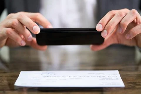 Scanning Remote Deposit Check Document Using Phone Stock Photos