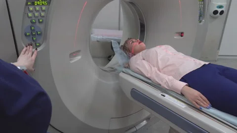 A scanning room with computers and monitors next to the CT scan room in a new Stock Footage 107001824