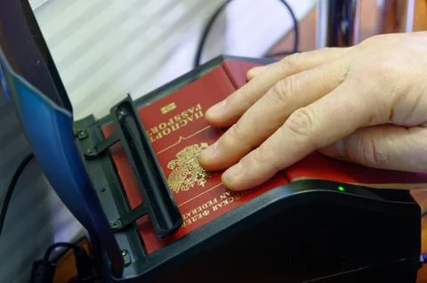Scanning a Russian passport for border control Foto stock