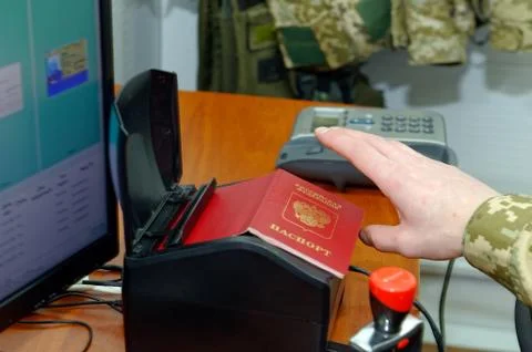 Scanning a Russian passport for border control Stock Photos