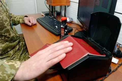 Scanning a Russian passport for border control 库存照片