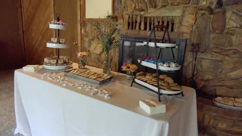 Scanning various inviting confections arrayed on a table before a wedding Vídeos de archivo 196773922