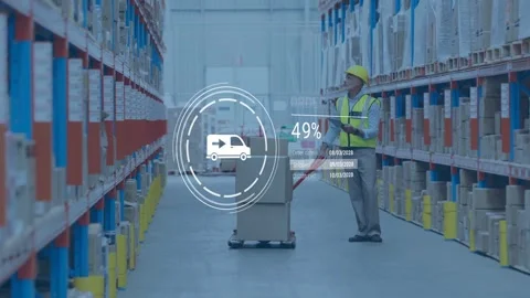 Scanning warehouse worker in hard hat updating order progress while pushing Stock Footage 332821953