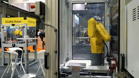 SCARA Robots arm in action Stock Footage 127798937