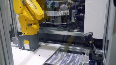 SCARA Robots arm in action Stock Footage 127799186