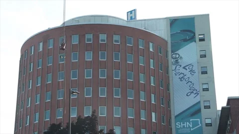 Scarborough general hospital with crane cable hanging and rocking side to side Video stock 246132353