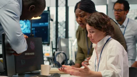 Scared admins in office panicked by alert, trying to stop hacker intrusion Stock Footage 323032170
