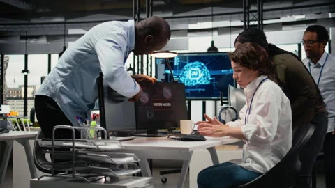 Scared admins in office panicked by alert, trying to stop hacker intrusion Stock Footage 323238016