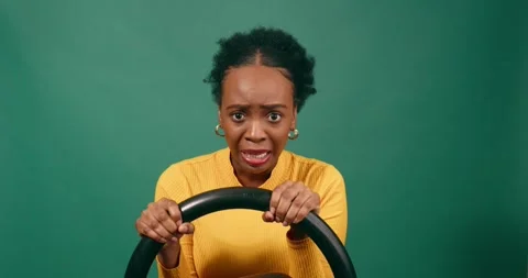 Scared and nervous learner driver behind the wheel, driving studio Stock Footage 249268270