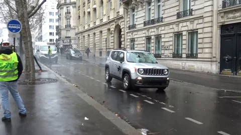 Scared car owner drives it in reverse to escape violent rioting crowd in Paris Stock Footage 103234342