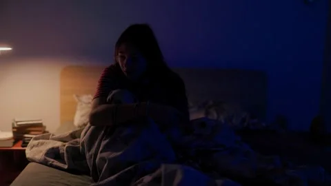 Scared child throwing blanket off waking up in panic from severe night terror Stock-Footage 336670032