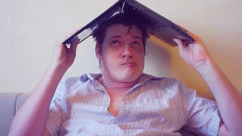 scared crazy user sitting with laptop on... | Stock Video | Pond5