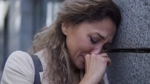 Scared female crying and looking around,... | Stock Video | Pond5