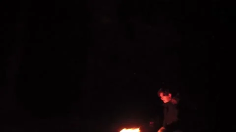 Scared guy in night forest looks around waiting for an action Stock Footage 154630654