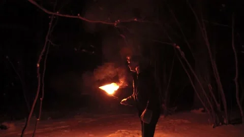 Scared guy in night forest looks around waiting for an action Stock Footage 154682538