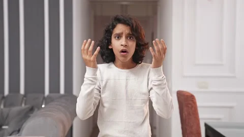 Scared Indian kid boy panicking about something Stock Footage 237991365