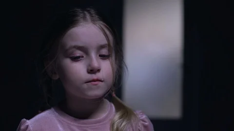 Scared little child crying on camera, silhouette of burglar outside door, fear Video stock 108751526