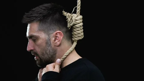 Scared man with hangmans noose around neck looking at camera, death penalty Stock Footage 108010617
