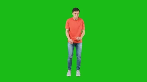 Scared man looking away with caution. Green background Stock Footage 184769555