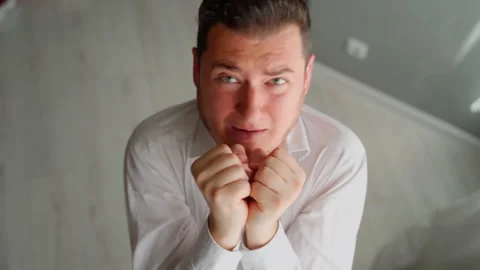 Scared man office worker afraid boss looking at camera. You are fired Stock Footage 154500032