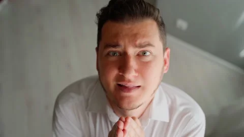 Scared man office worker afraid boss looking at camera praying. fired quit Stock Footage 154500045