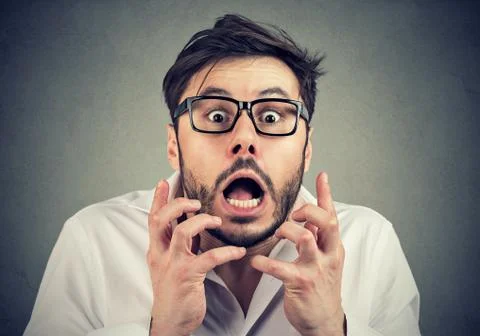 Scared man in panic looking at camera Stock Photos
