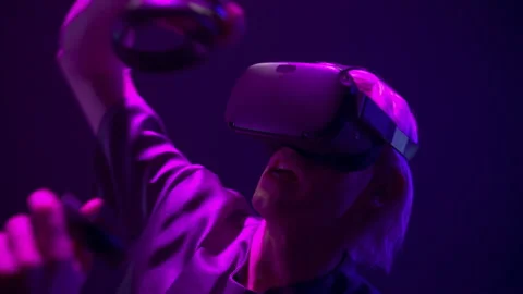 Scared man playing handheld trackpads videogame. Youngster testing horror game Stock Footage 210536350