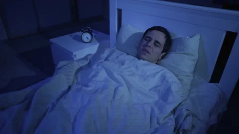Scared man woke up from a nightmare Stock Footage 165346652