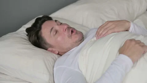 Scared Middle Aged Man Waking up from Nightmare in Bed 스톡 동영상 142366727