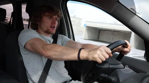 Scared novice driver slowly gets used to controlling a car Video stock 343719990